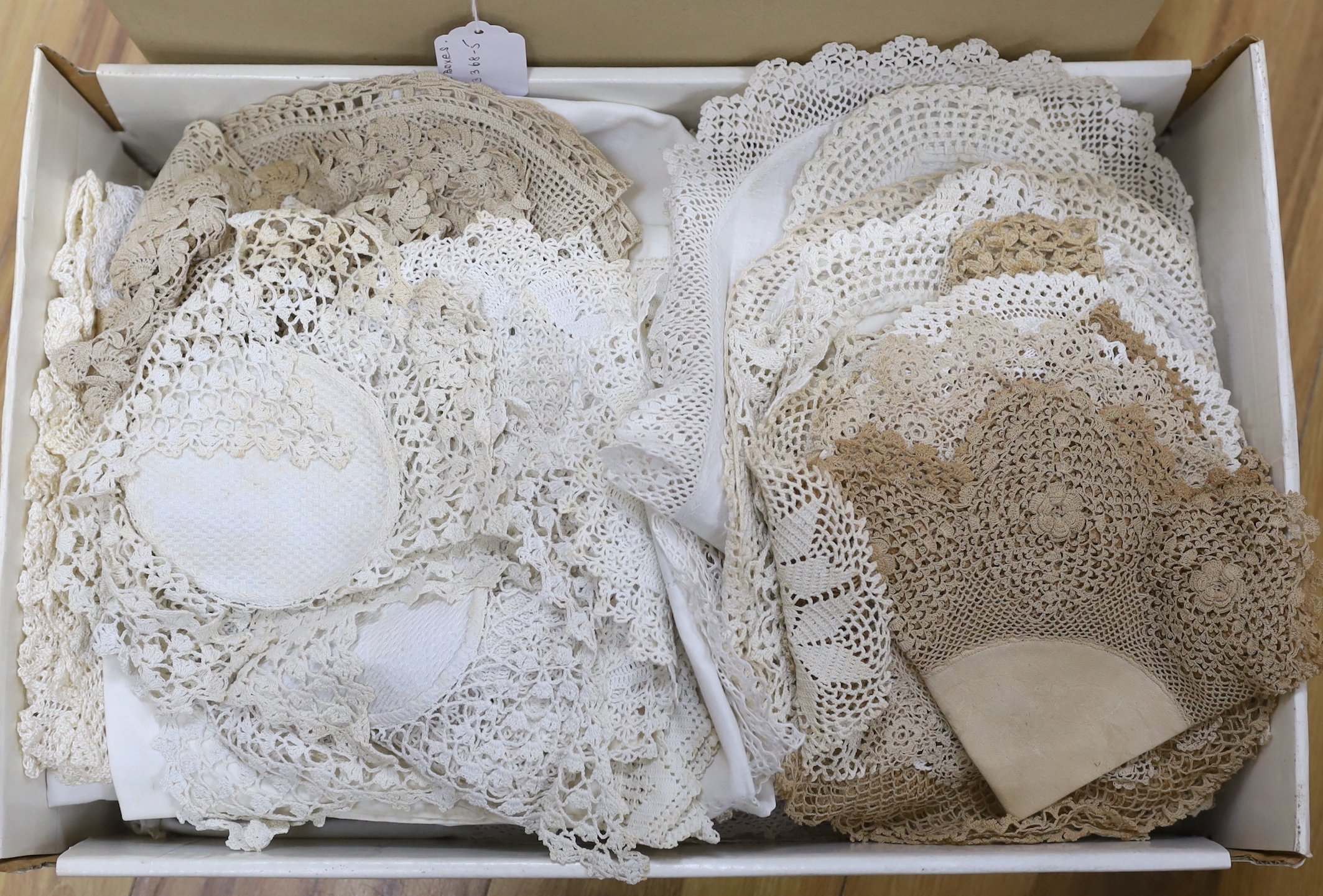 A large collection of ornate hand crochet edged table cloths, mats etc